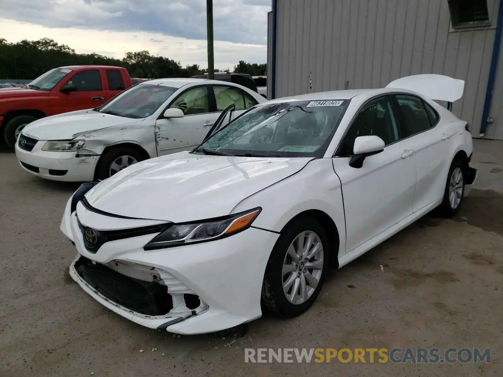 2 Photograph of a damaged car 4T1B11HK1KU723414 TOYOTA CAMRY 2019