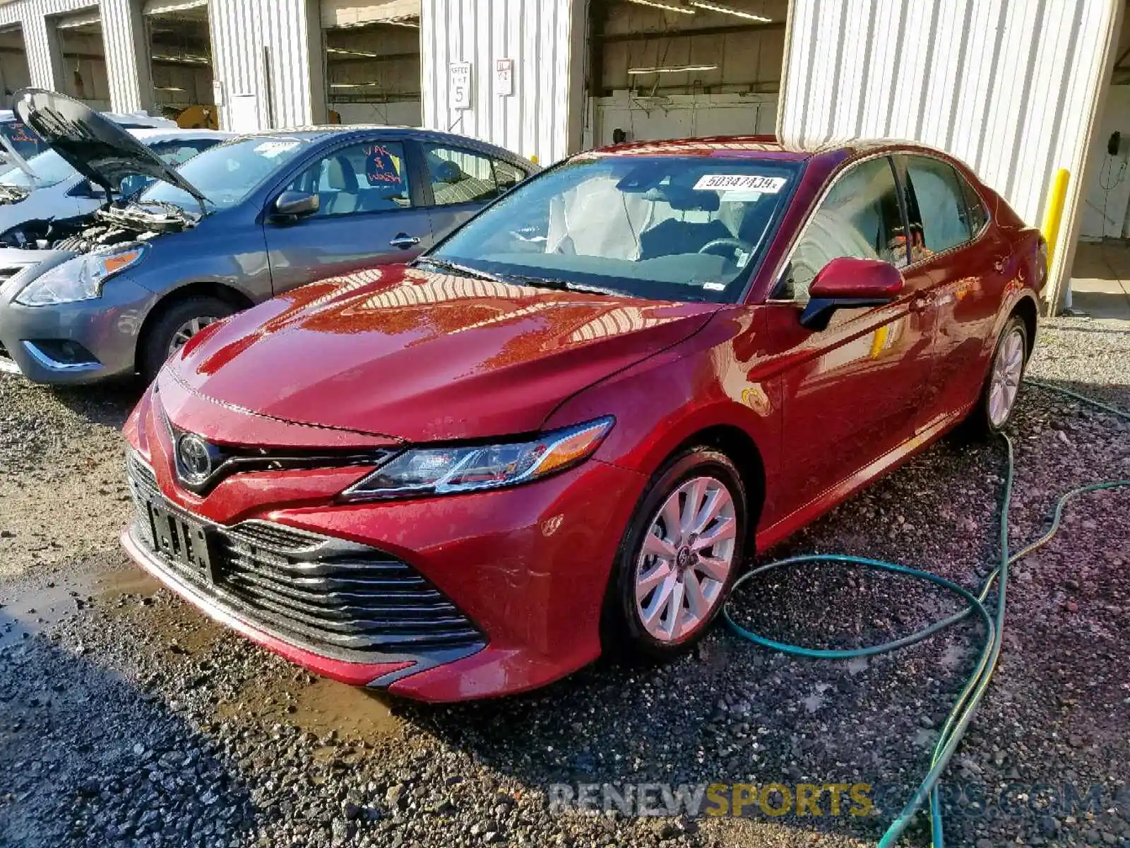 2 Photograph of a damaged car 4T1B11HK1KU742335 TOYOTA CAMRY 2019