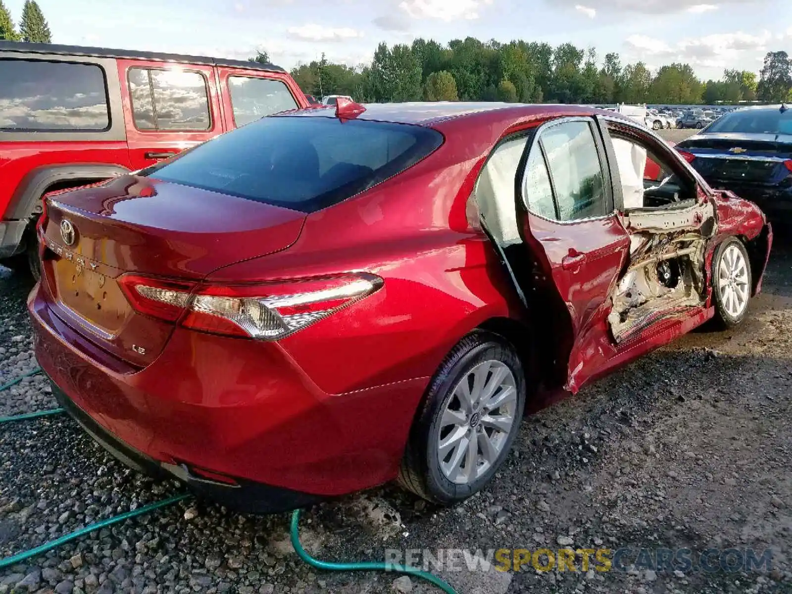 4 Photograph of a damaged car 4T1B11HK1KU742335 TOYOTA CAMRY 2019