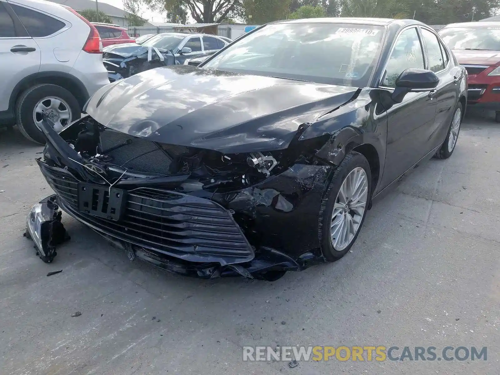 2 Photograph of a damaged car 4T1B11HK1KU752959 TOYOTA CAMRY 2019