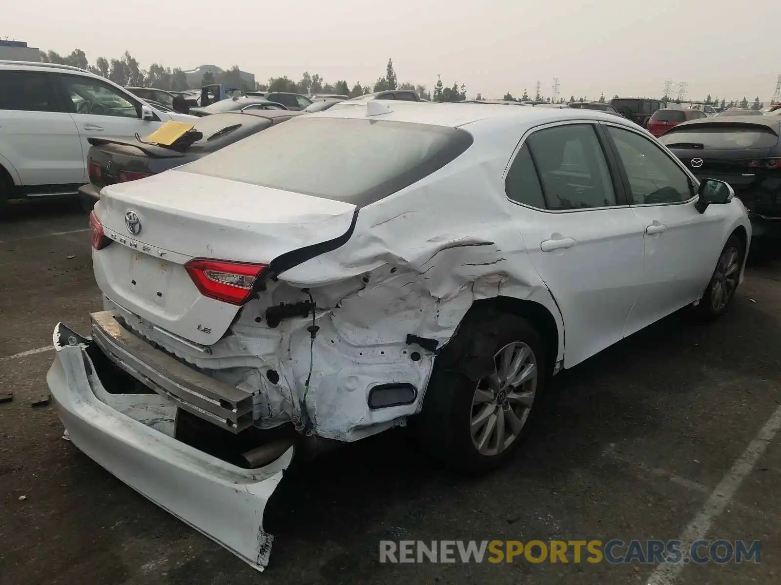 4 Photograph of a damaged car 4T1B11HK1KU756459 TOYOTA CAMRY 2019