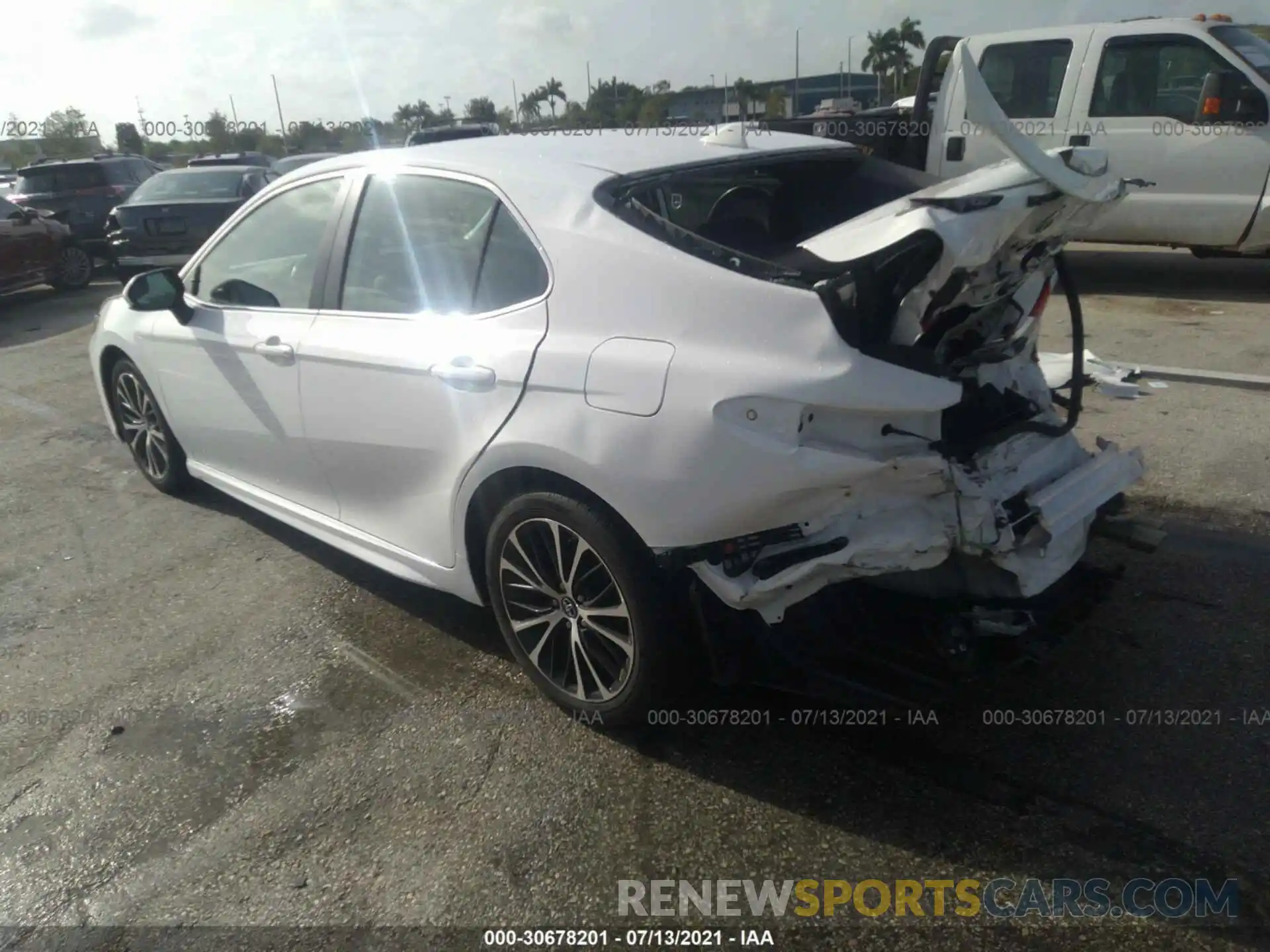 3 Photograph of a damaged car 4T1B11HK1KU796928 TOYOTA CAMRY 2019