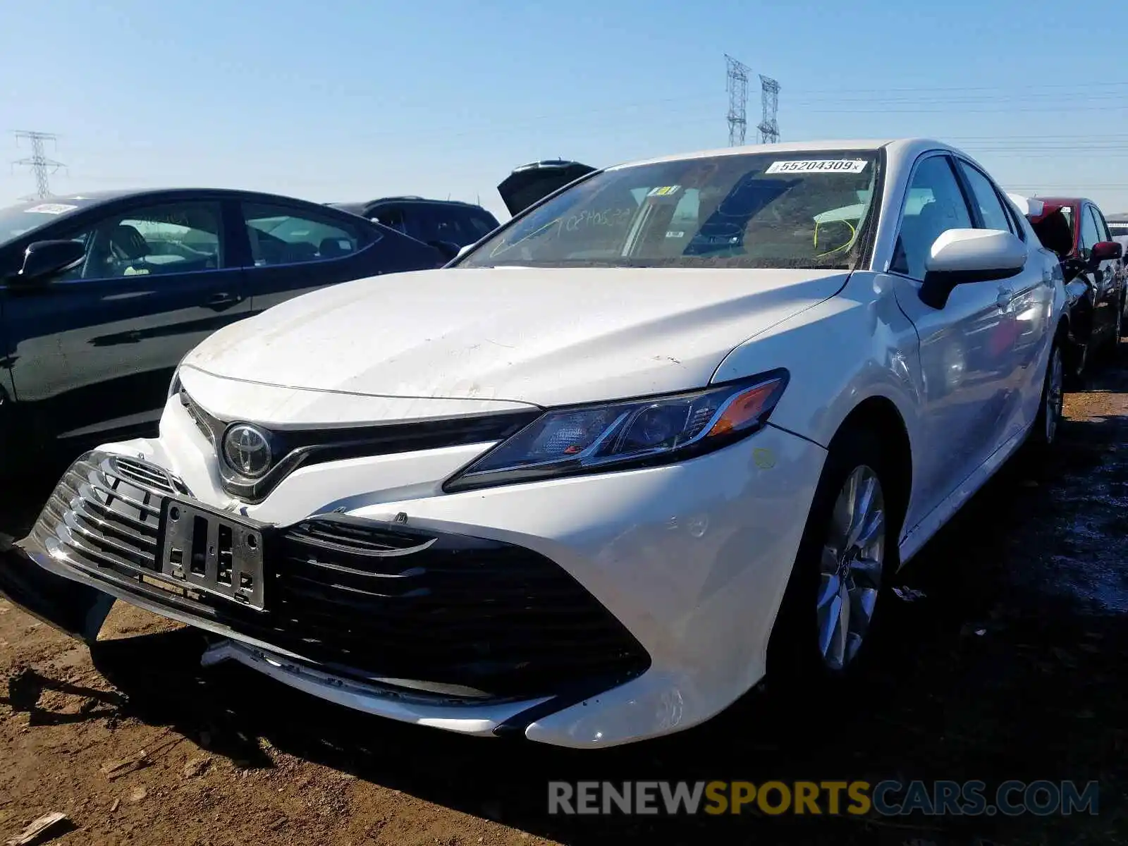 2 Photograph of a damaged car 4T1B11HK2KU242877 TOYOTA CAMRY 2019