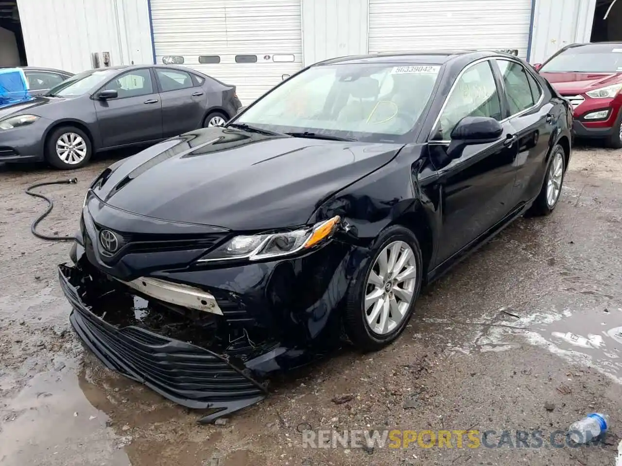 2 Photograph of a damaged car 4T1B11HK2KU704547 TOYOTA CAMRY 2019