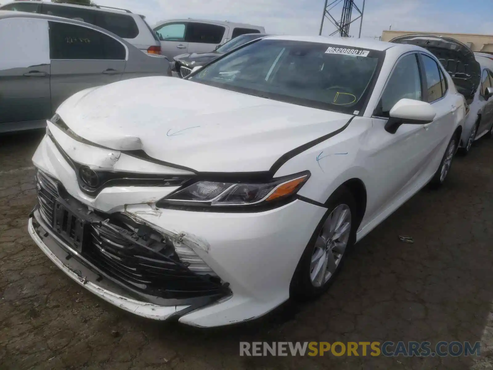 2 Photograph of a damaged car 4T1B11HK3KU243813 TOYOTA CAMRY 2019