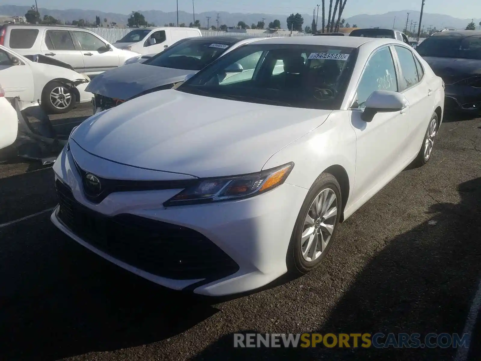 2 Photograph of a damaged car 4T1B11HK3KU270980 TOYOTA CAMRY 2019