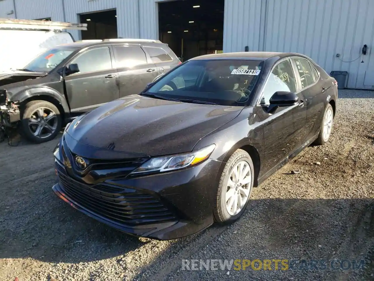 2 Photograph of a damaged car 4T1B11HK3KU768614 TOYOTA CAMRY 2019