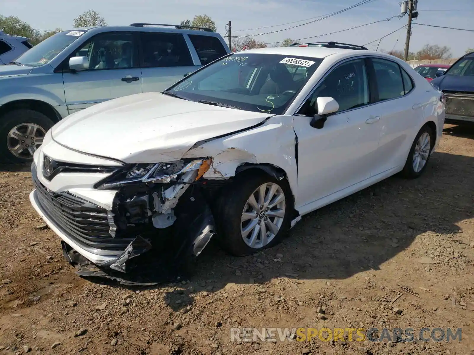 2 Photograph of a damaged car 4T1B11HK4KU219178 TOYOTA CAMRY 2019