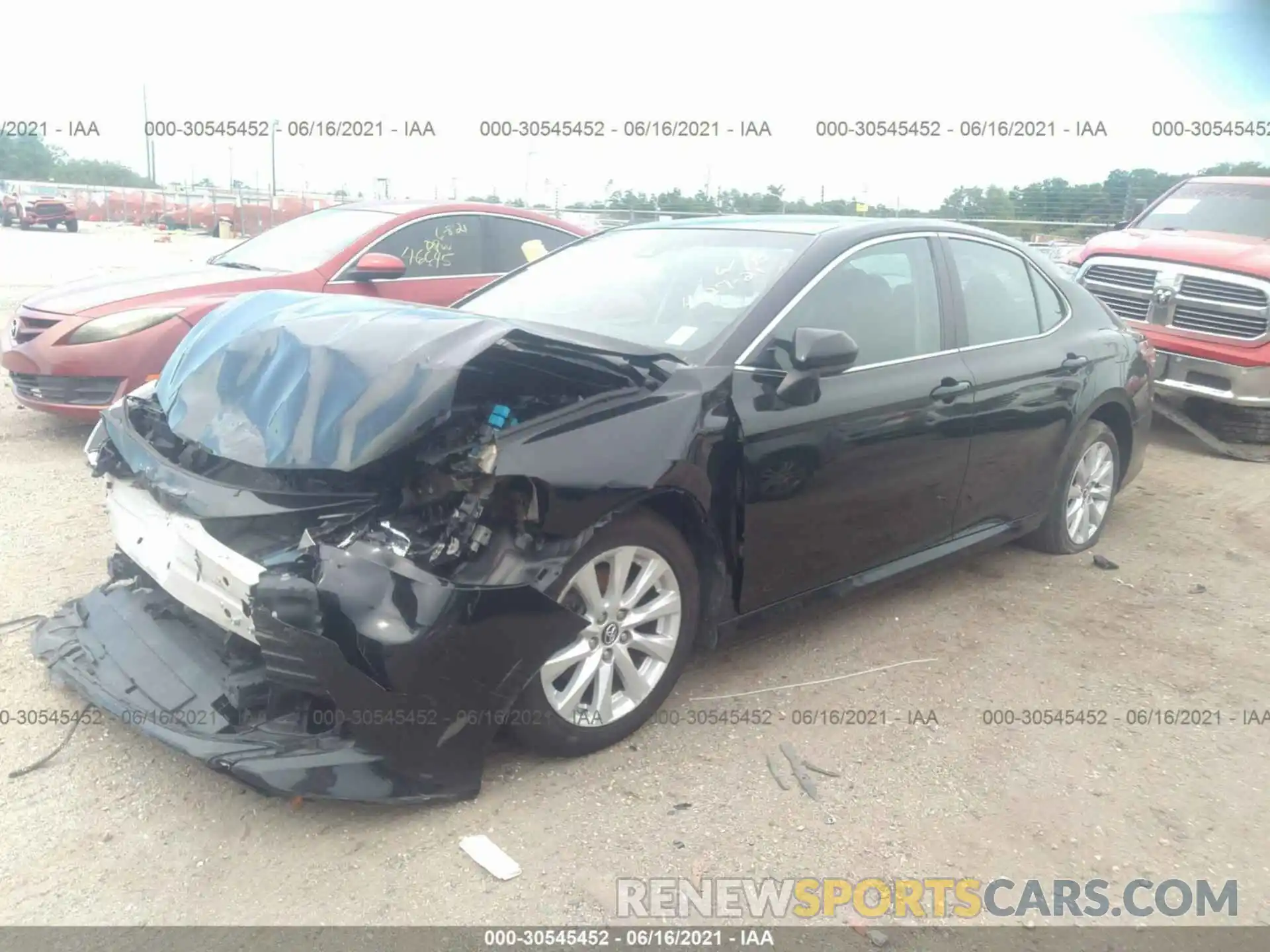 2 Photograph of a damaged car 4T1B11HK4KU219651 TOYOTA CAMRY 2019