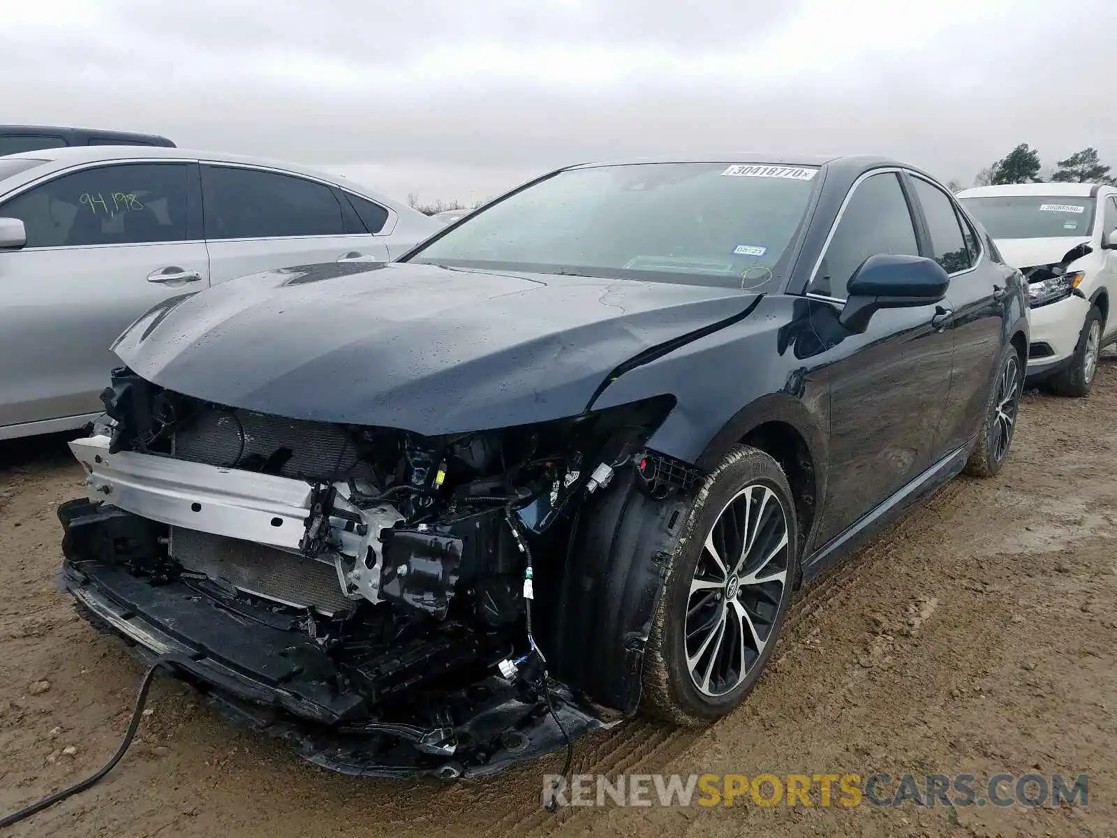 2 Photograph of a damaged car 4T1B11HK4KU297945 TOYOTA CAMRY 2019