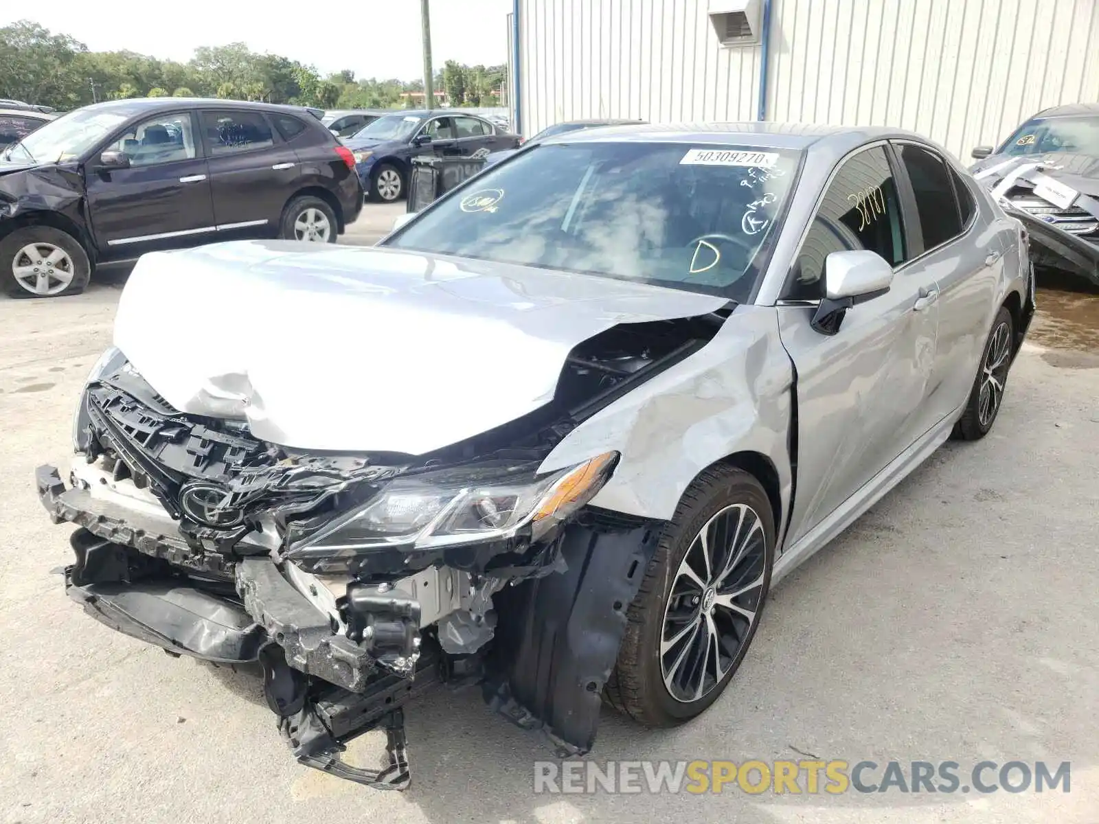 2 Photograph of a damaged car 4T1B11HK4KU682597 TOYOTA CAMRY 2019