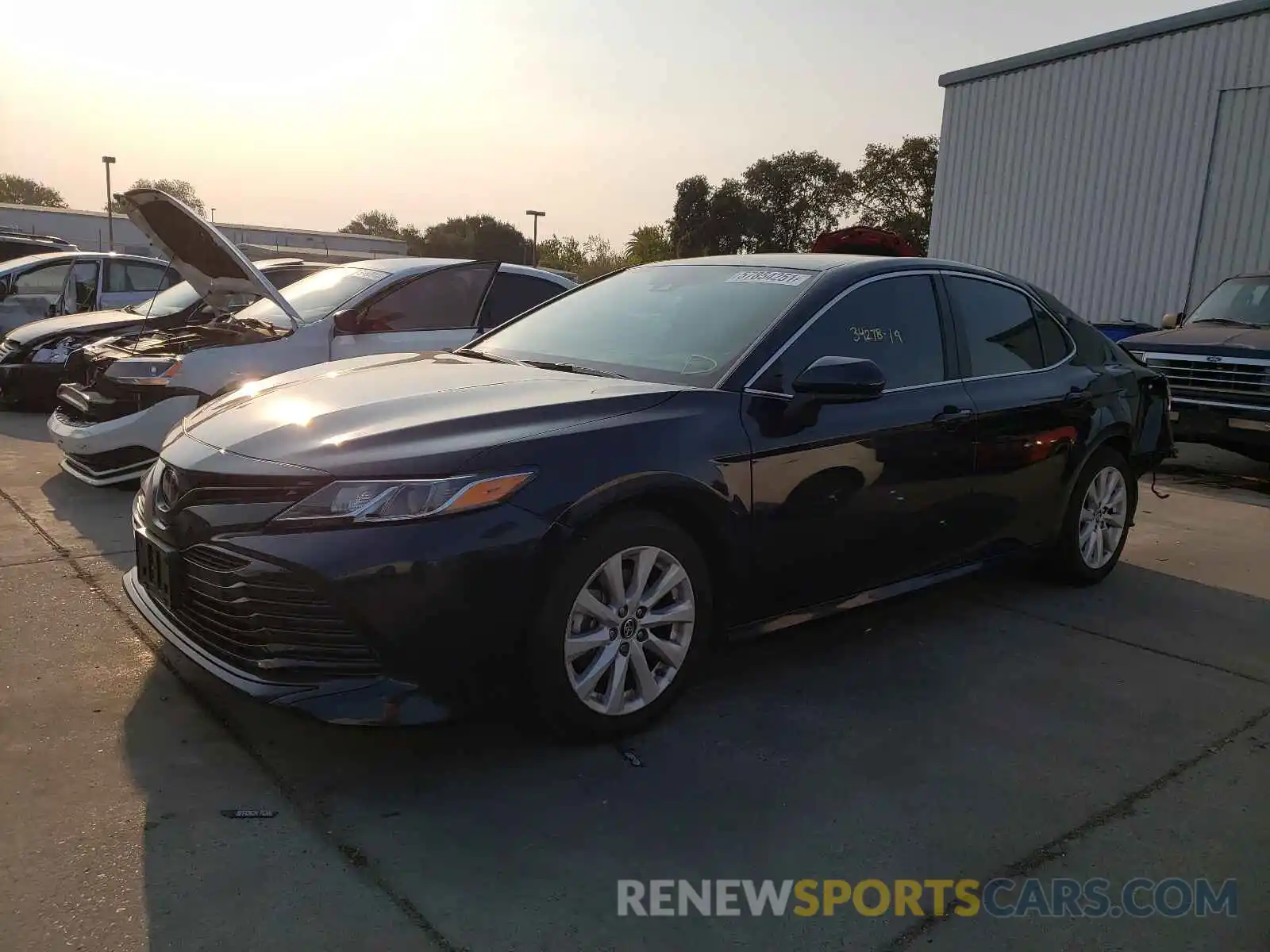 2 Photograph of a damaged car 4T1B11HK4KU683975 TOYOTA CAMRY 2019