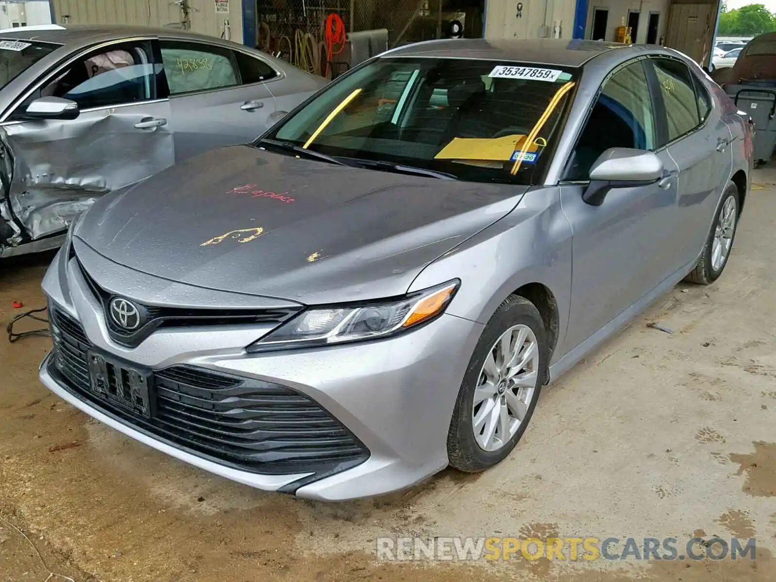 2 Photograph of a damaged car 4T1B11HK4KU686519 TOYOTA CAMRY 2019