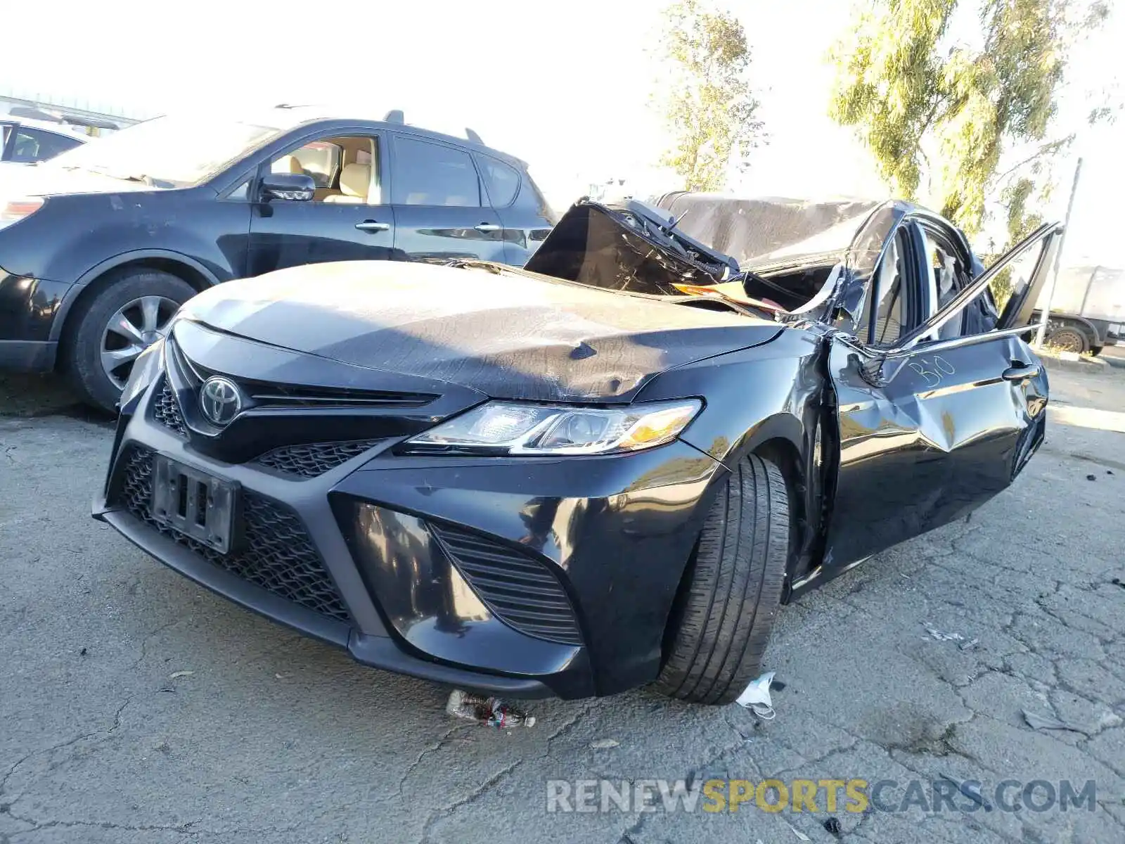 2 Photograph of a damaged car 4T1B11HK4KU689579 TOYOTA CAMRY 2019