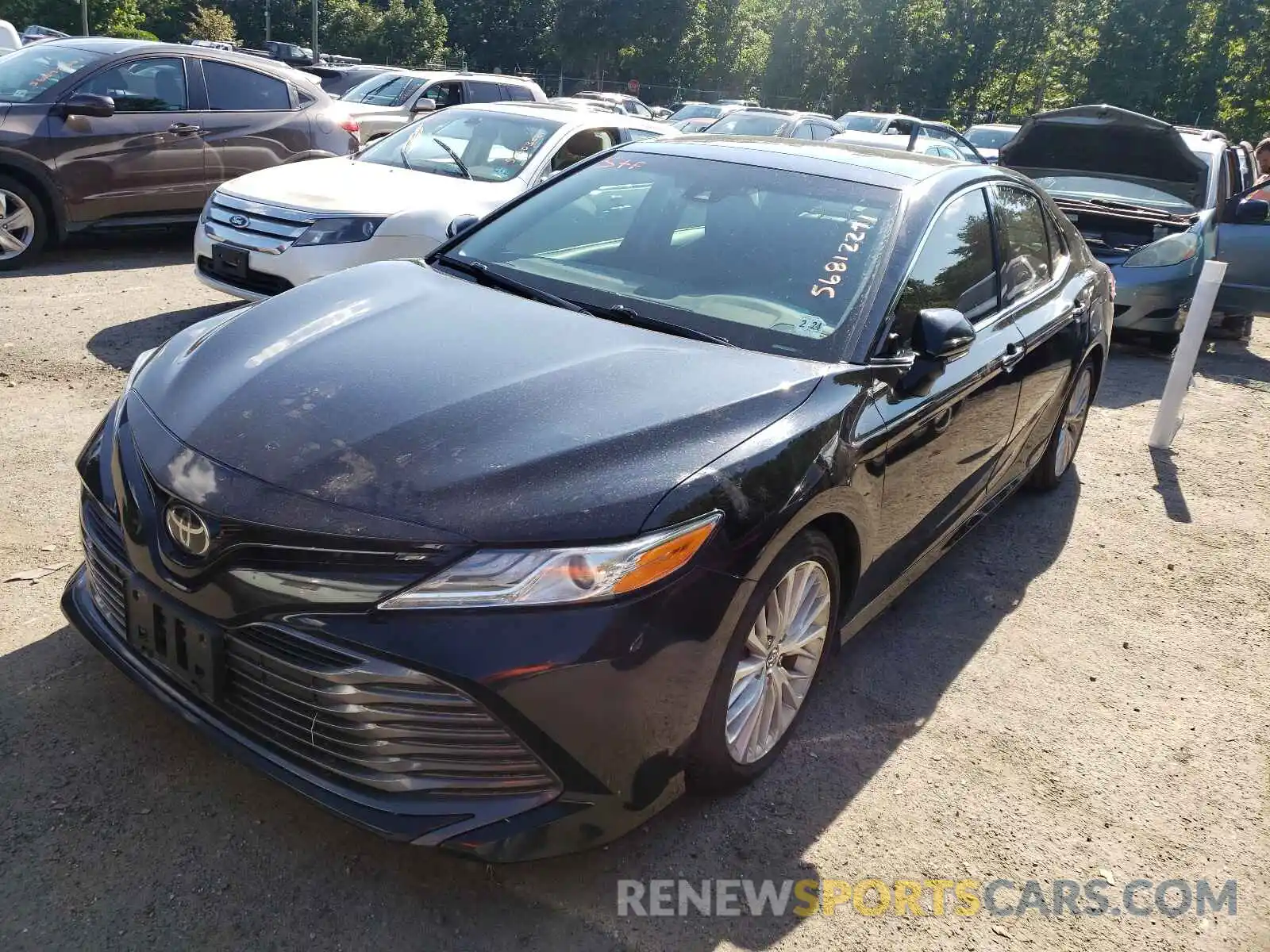 2 Photograph of a damaged car 4T1B11HK4KU694510 TOYOTA CAMRY 2019