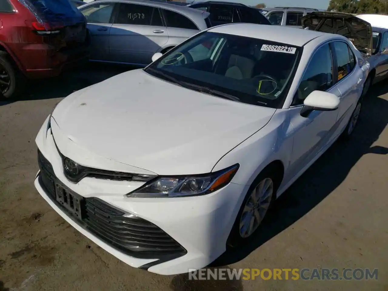 2 Photograph of a damaged car 4T1B11HK4KU753913 TOYOTA CAMRY 2019