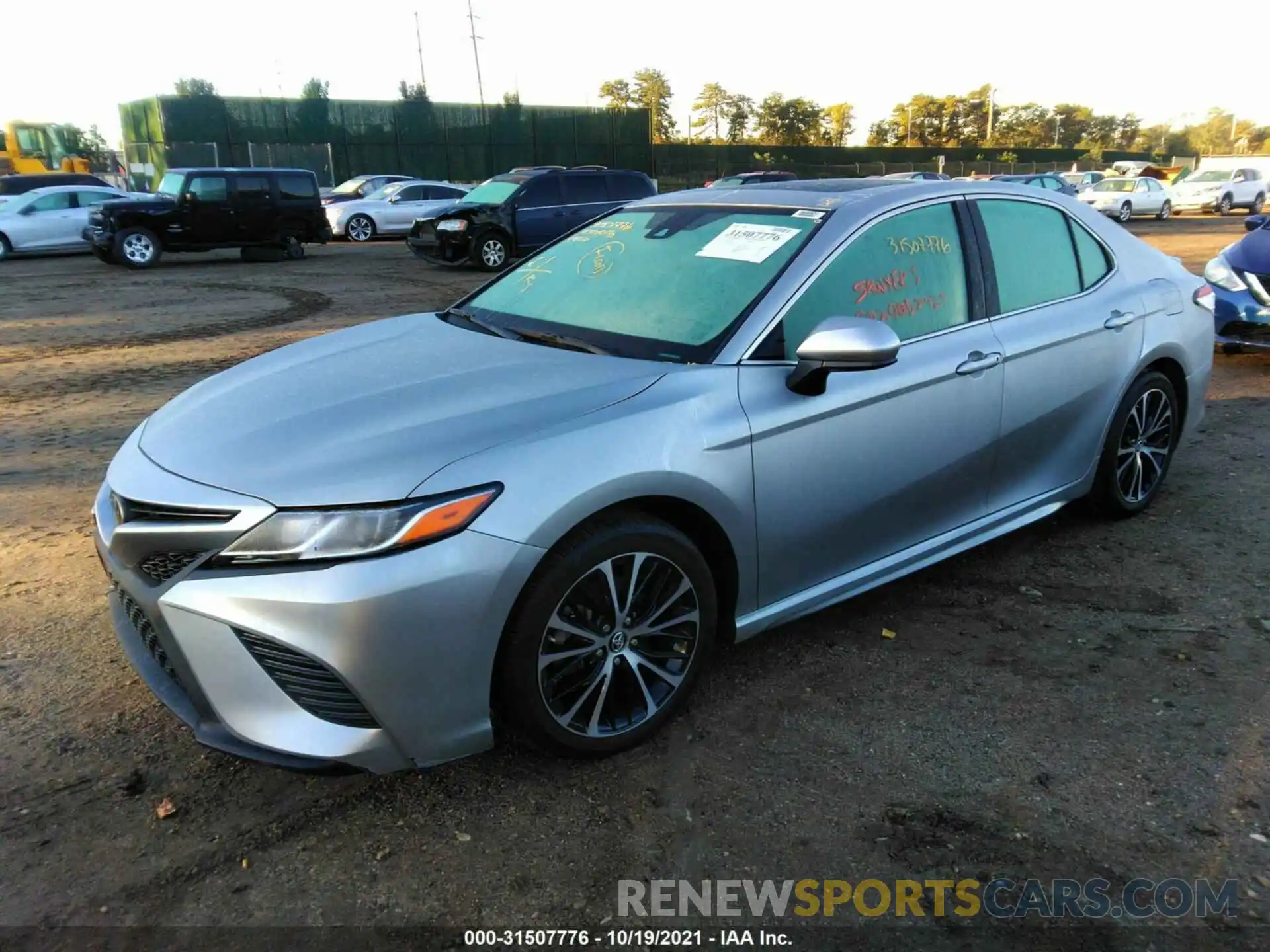 2 Photograph of a damaged car 4T1B11HK4KU813818 TOYOTA CAMRY 2019