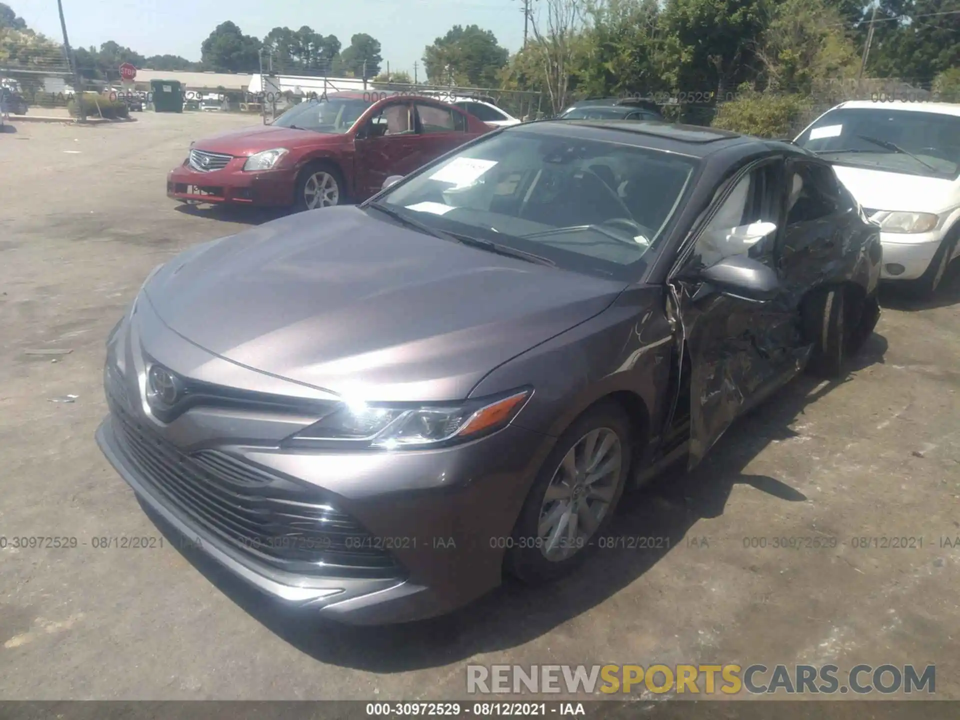 2 Photograph of a damaged car 4T1B11HK4KU817965 TOYOTA CAMRY 2019