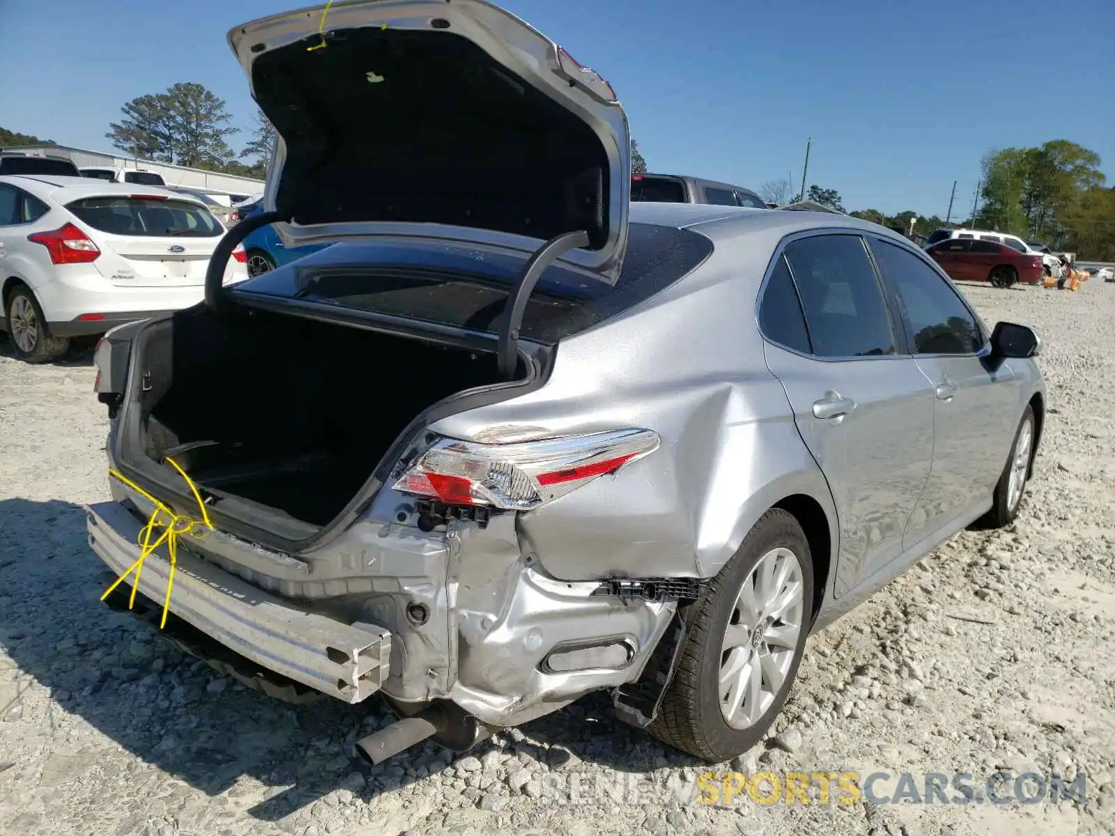 4 Photograph of a damaged car 4T1B11HK5KU196316 TOYOTA CAMRY 2019