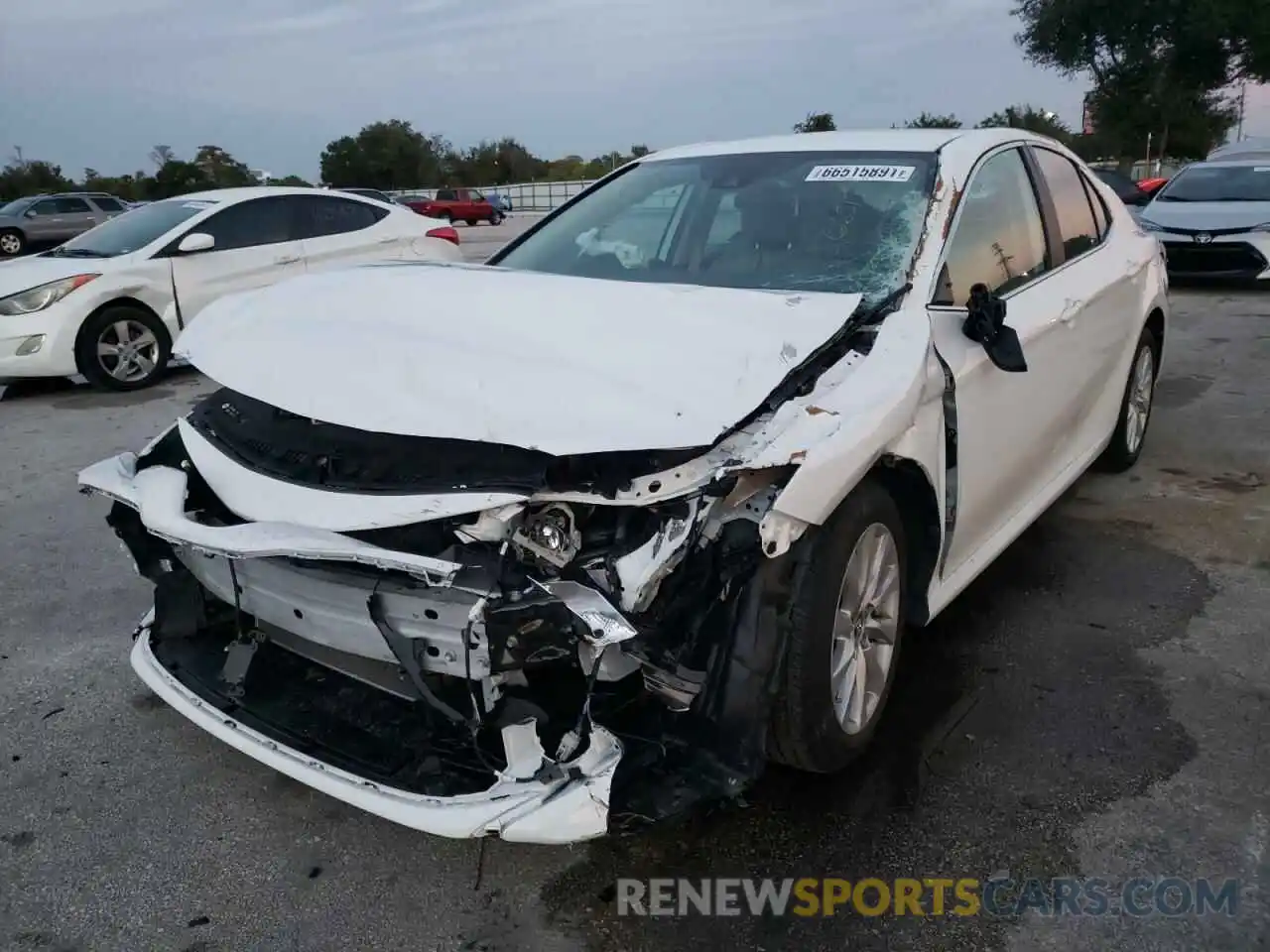 2 Photograph of a damaged car 4T1B11HK5KU223725 TOYOTA CAMRY 2019