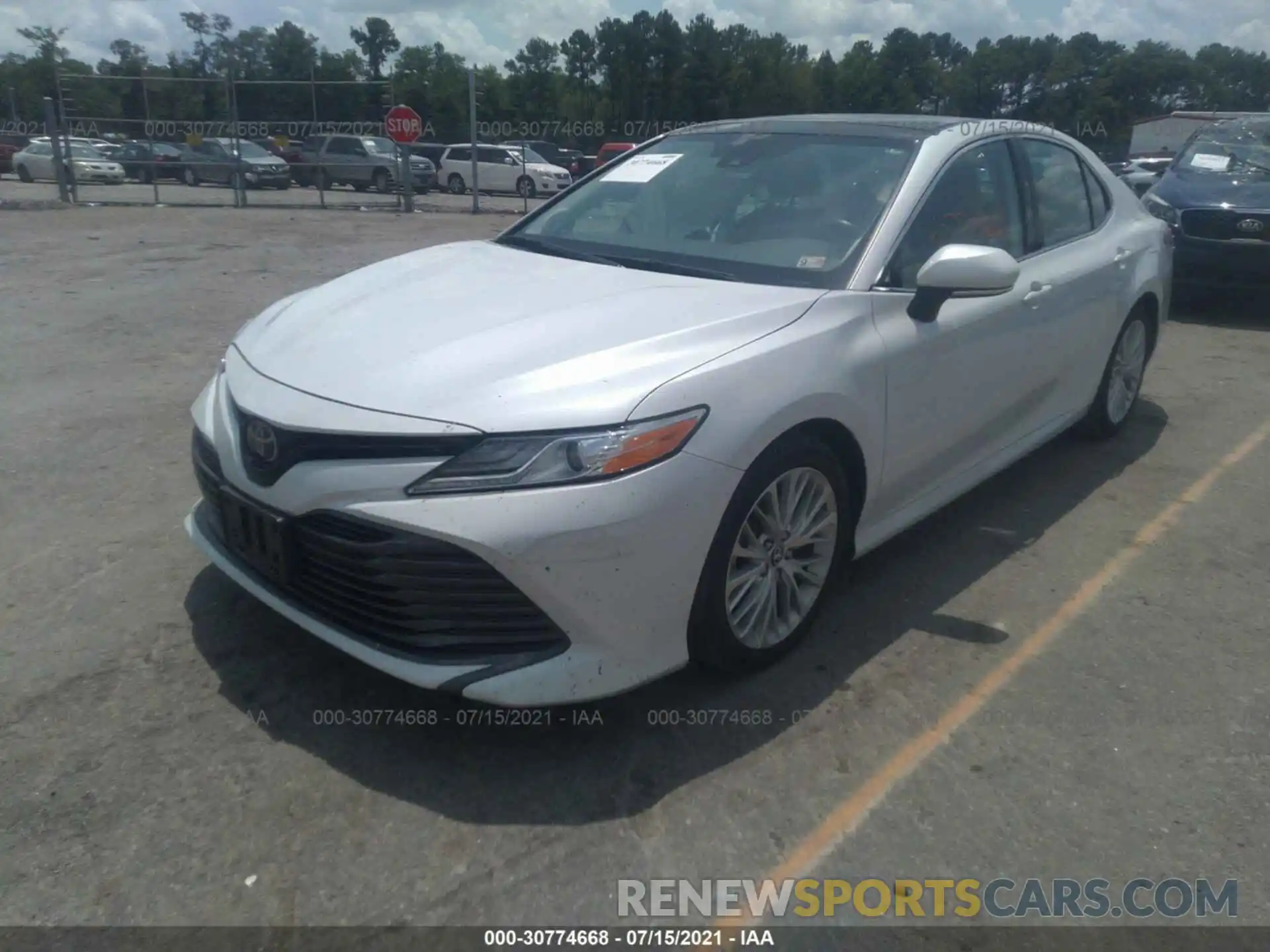 2 Photograph of a damaged car 4T1B11HK5KU679384 TOYOTA CAMRY 2019