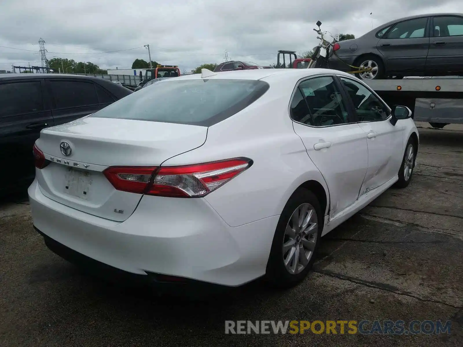 4 Photograph of a damaged car 4T1B11HK5KU800284 TOYOTA CAMRY 2019