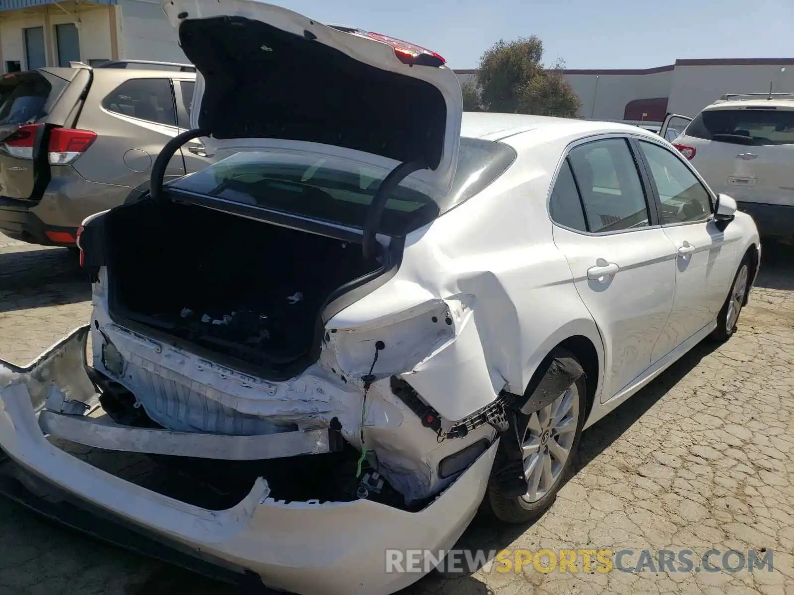 4 Photograph of a damaged car 4T1B11HK6KU784337 TOYOTA CAMRY 2019
