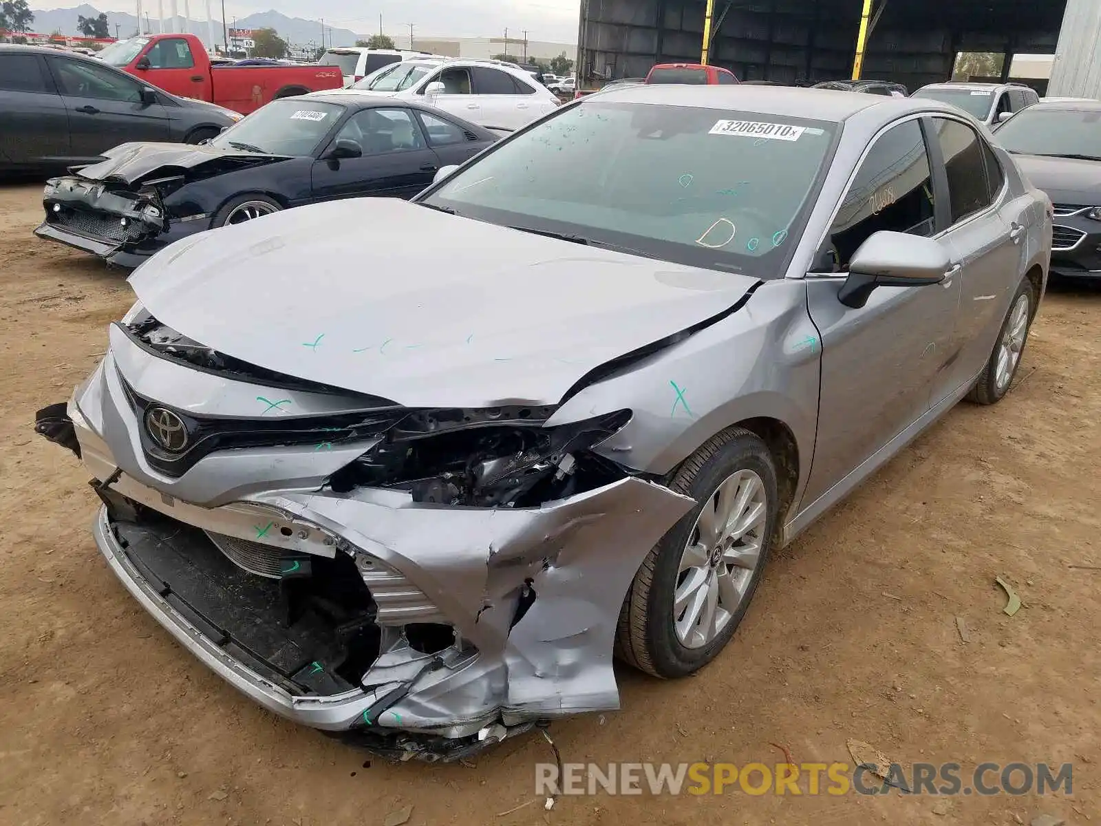 2 Photograph of a damaged car 4T1B11HK7KU212211 TOYOTA CAMRY 2019