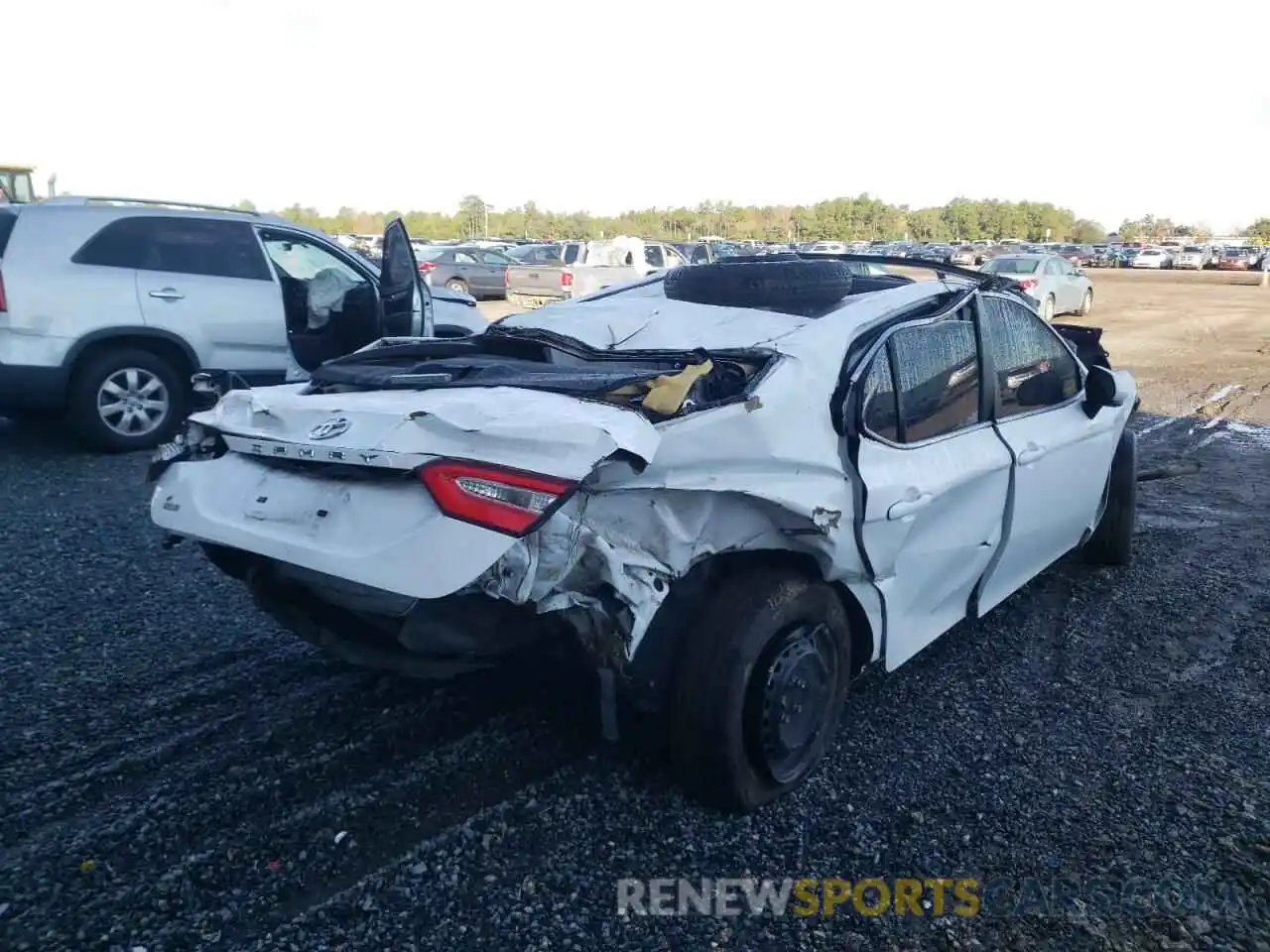 4 Photograph of a damaged car 4T1B11HK7KU801291 TOYOTA CAMRY 2019