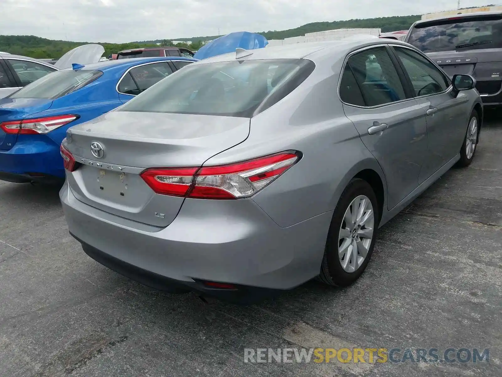 4 Photograph of a damaged car 4T1B11HK7KU802053 TOYOTA CAMRY 2019