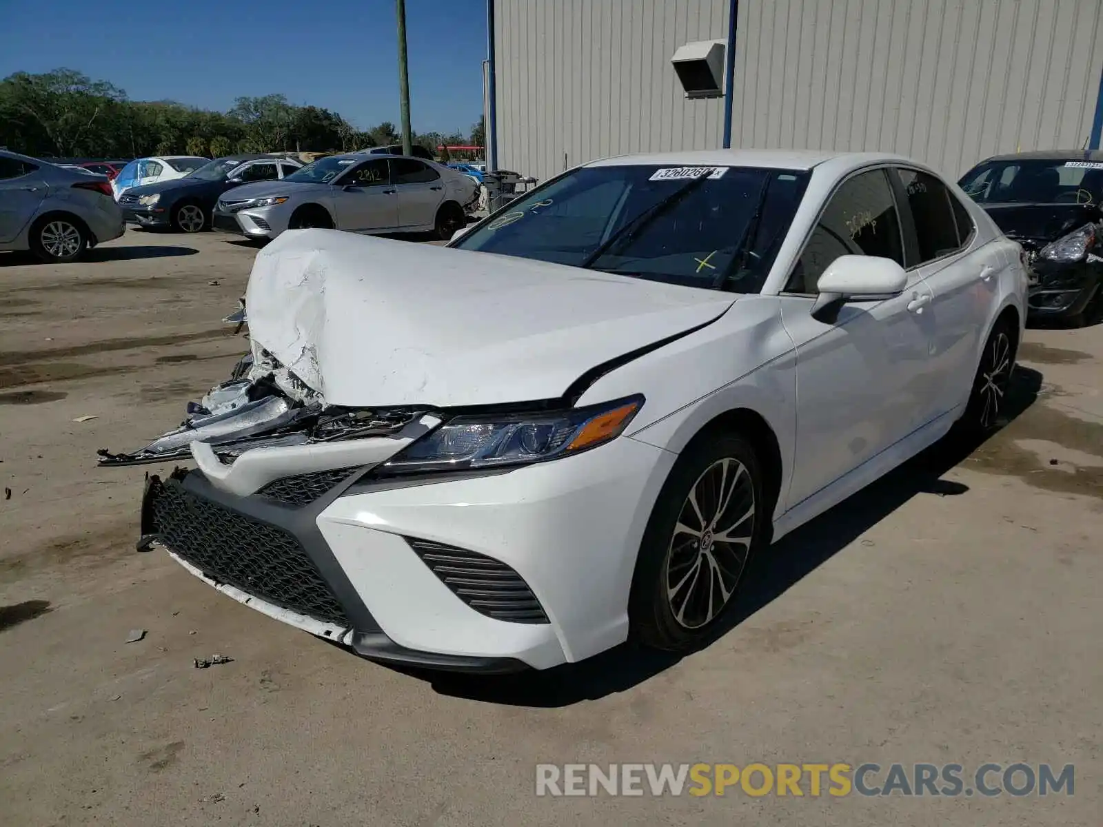 2 Photograph of a damaged car 4T1B11HKXKU219430 TOYOTA CAMRY 2019