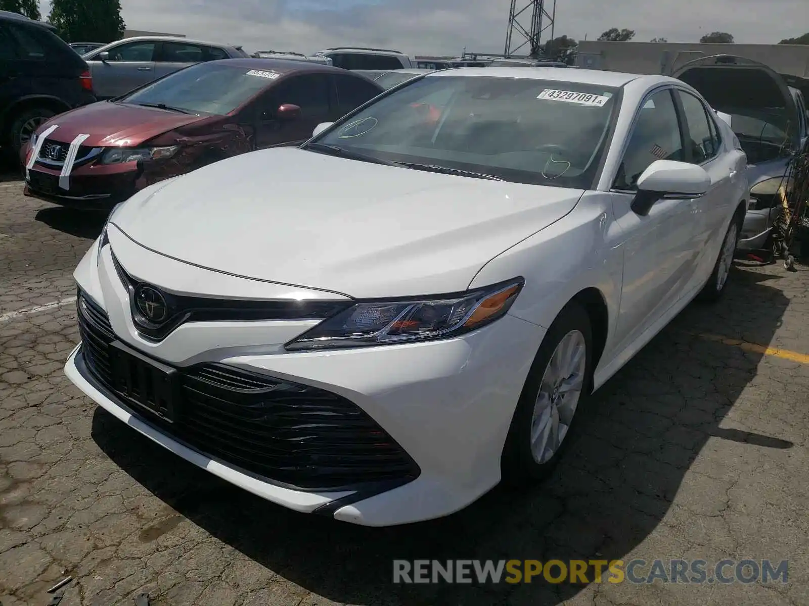 2 Photograph of a damaged car 4T1B11HKXKU836360 TOYOTA CAMRY 2019