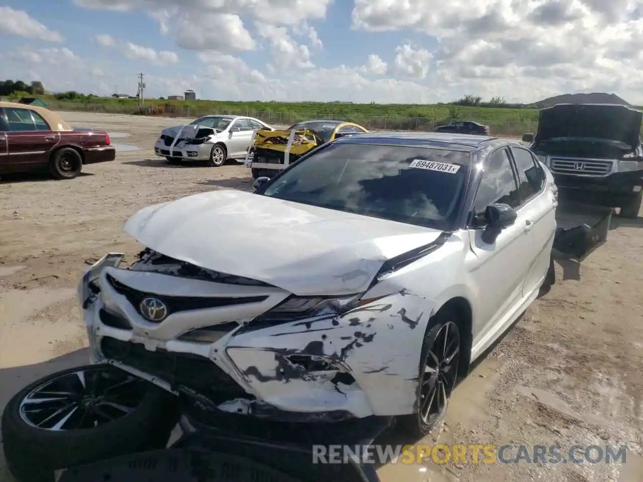 2 Photograph of a damaged car 4T1B61HK7KU211674 TOYOTA CAMRY 2019