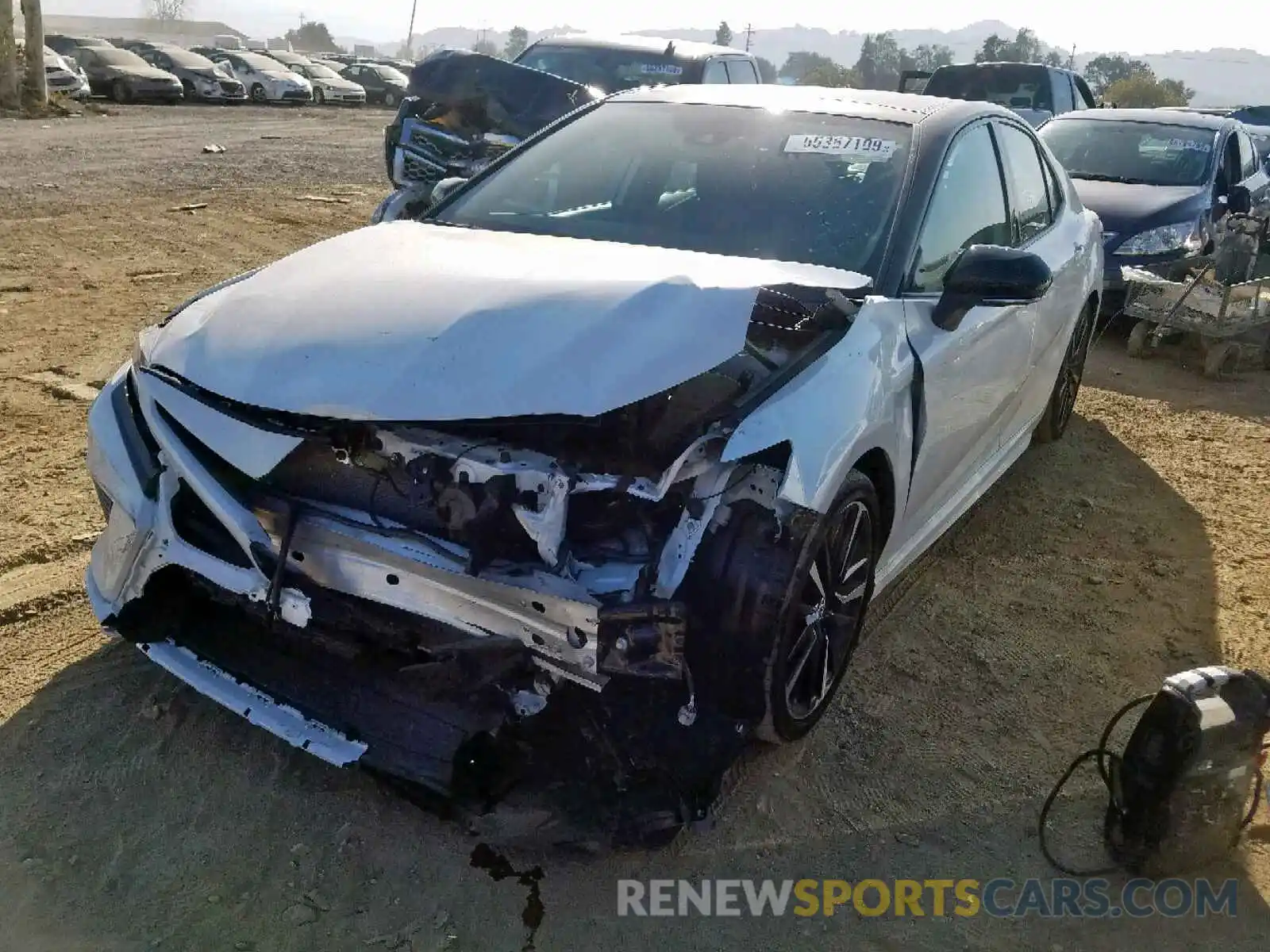 2 Photograph of a damaged car 4T1BZ1HK1KU025877 TOYOTA CAMRY 2019