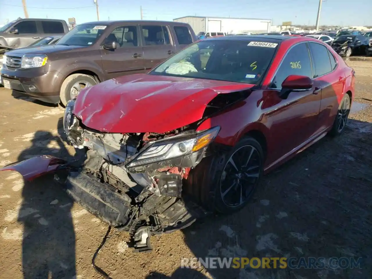 2 Photograph of a damaged car 4T1BZ1HK5KU023369 TOYOTA CAMRY 2019