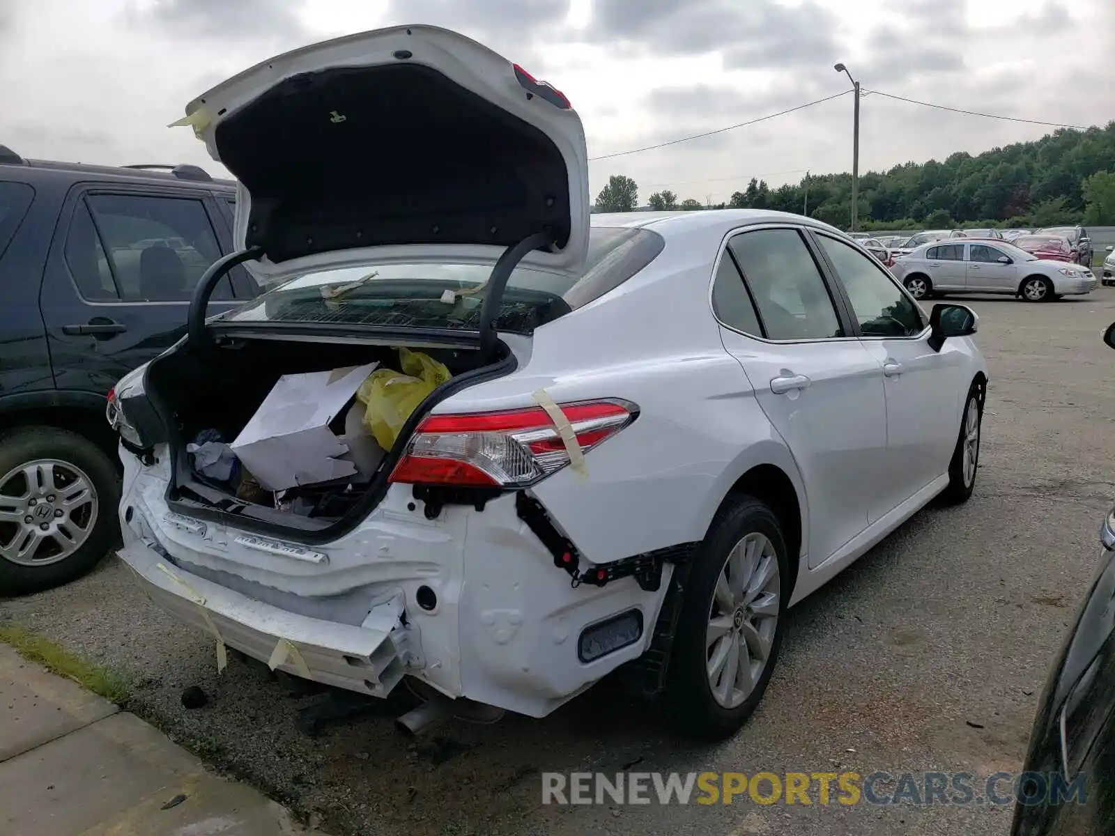 4 Photograph of a damaged car 4T1C11AK4LU990580 TOYOTA CAMRY 2020