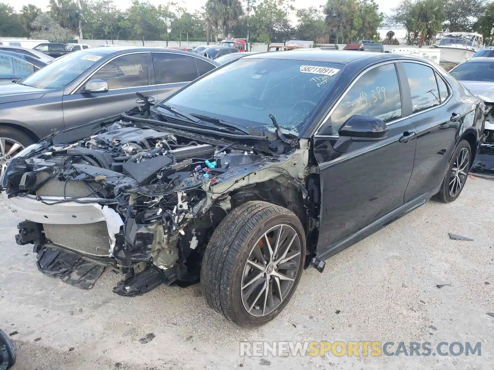 2 Photograph of a damaged car 4T1G11AK6MU404559 TOYOTA CAMRY 2021