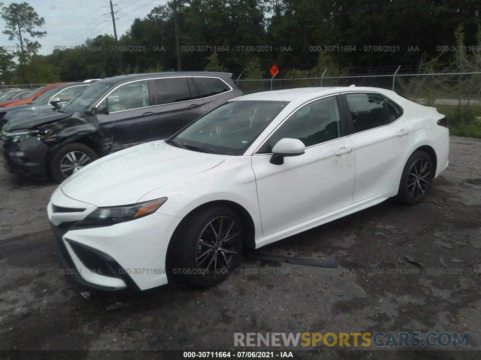 2 Photograph of a damaged car 4T1G11AKXMU407593 TOYOTA CAMRY 2021