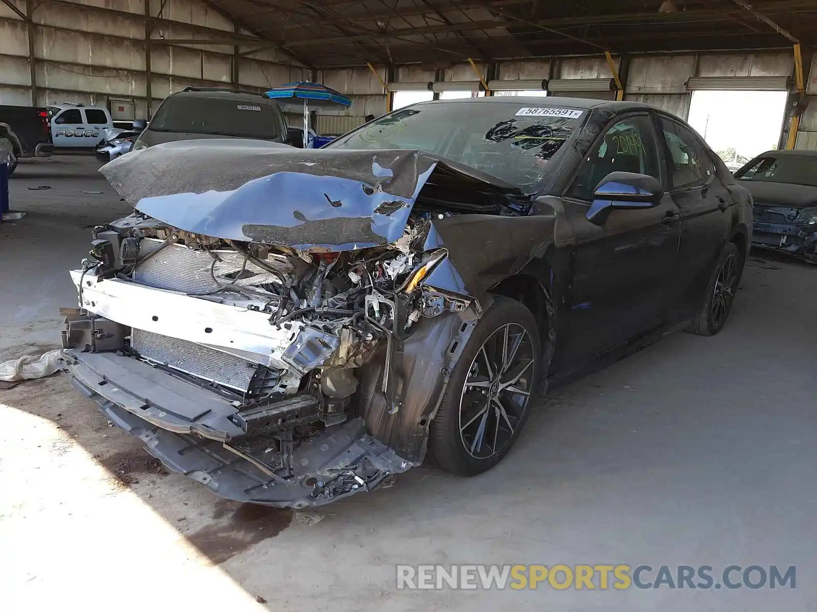 2 Photograph of a damaged car 4T1G11AKXMU423969 TOYOTA CAMRY 2021