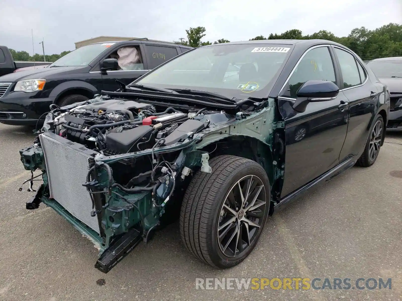 2 Photograph of a damaged car 4T1G11AKXMU474839 TOYOTA CAMRY 2021