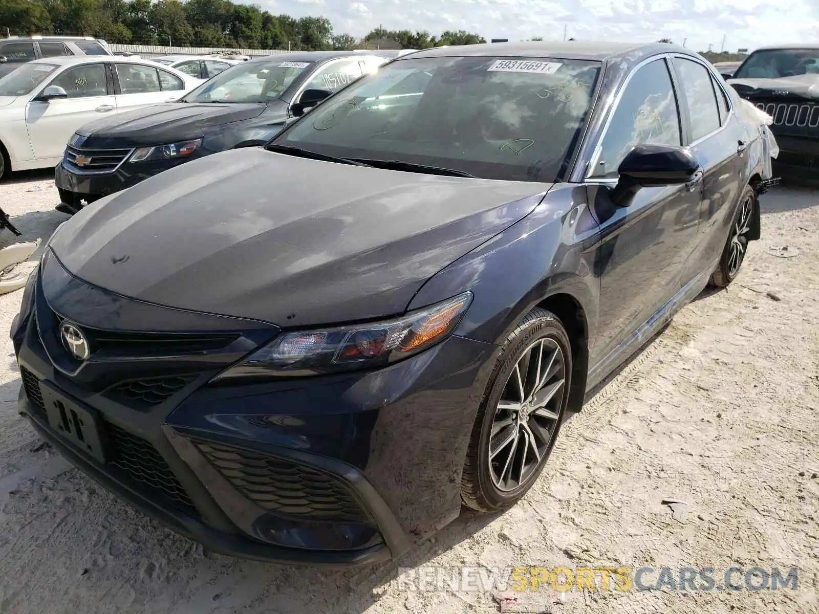 2 Photograph of a damaged car 4T1G11AKXMU486649 TOYOTA CAMRY 2021