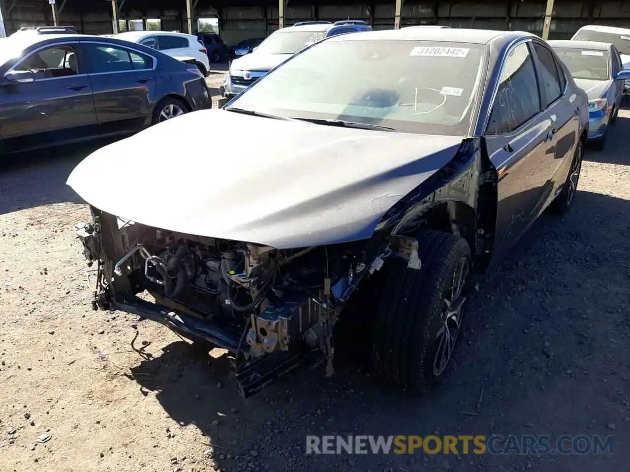 2 Photograph of a damaged car 4T1G11AKXMU543609 TOYOTA CAMRY 2021