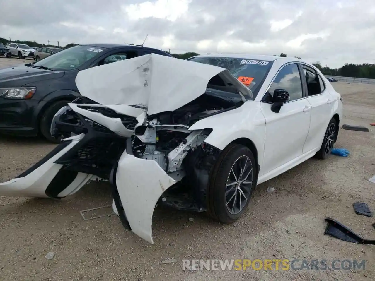 2 Photograph of a damaged car 4T1G11BK4MU029513 TOYOTA CAMRY 2021