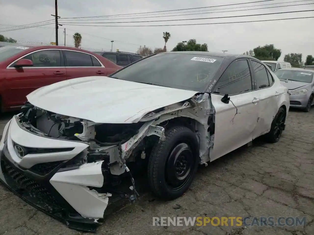 2 Photograph of a damaged car 4T1KZ1AK4MU053895 TOYOTA CAMRY 2021