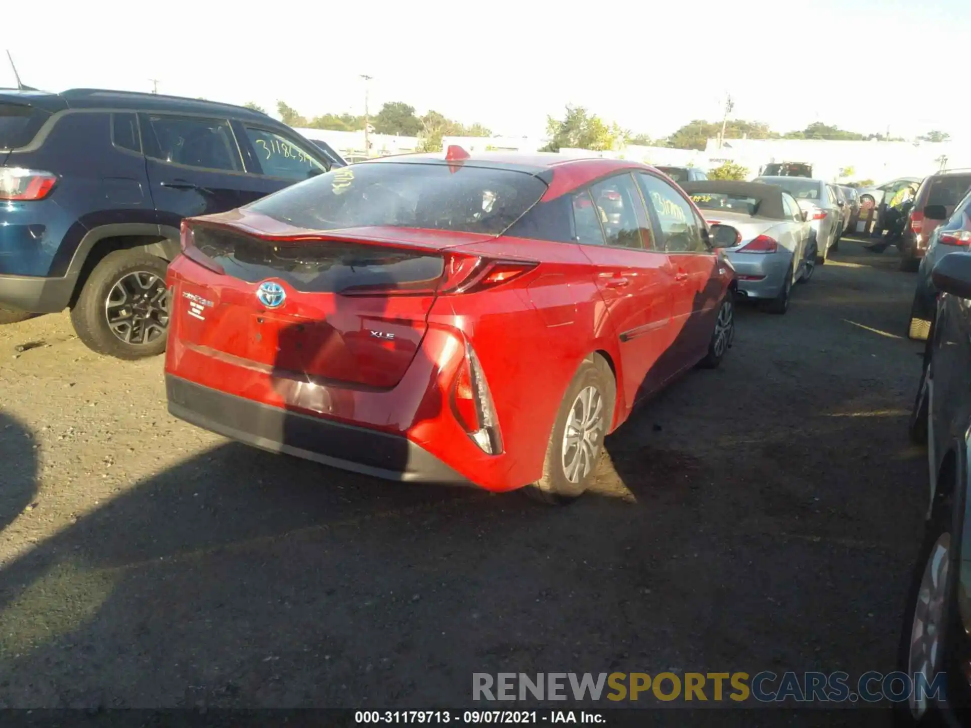 4 Photograph of a damaged car JTDKAMFP6M3180235 TOYOTA PRIUS PRIME 2021