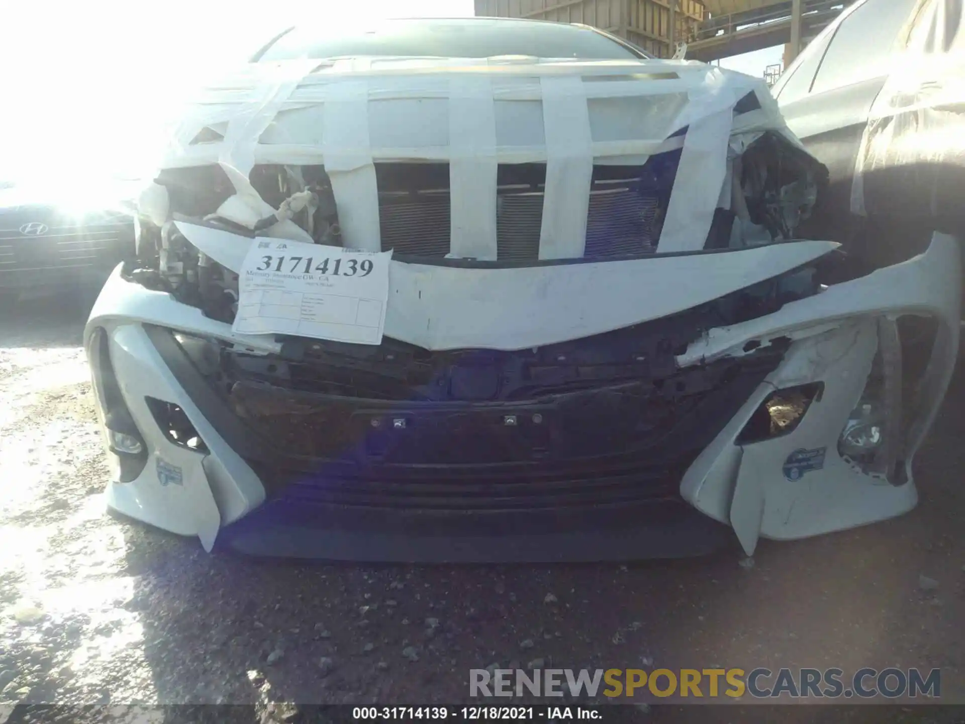 11 Photograph of a damaged car JTDKAMFPXM3180884 TOYOTA PRIUS PRIME 2021