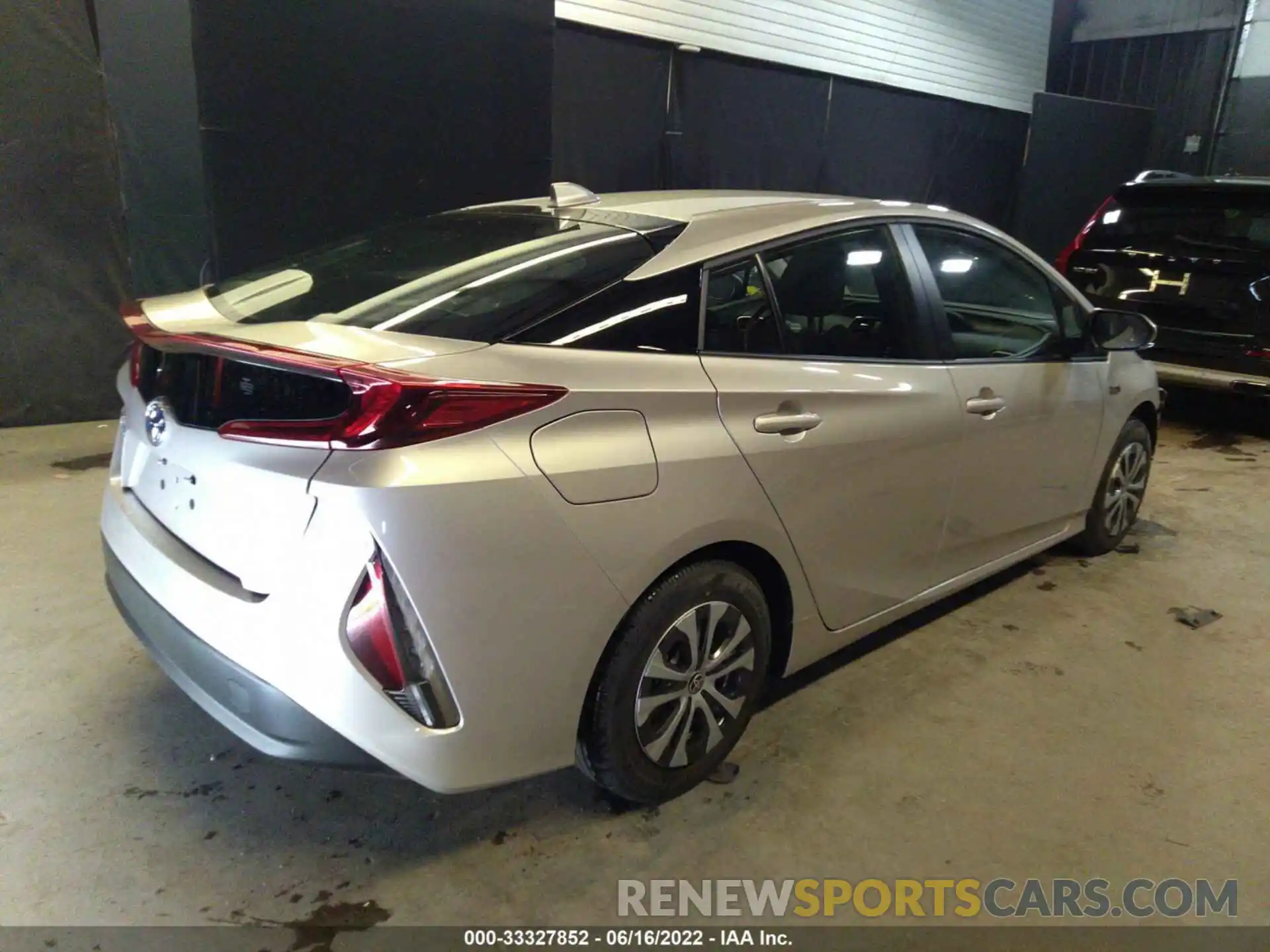 4 Photograph of a damaged car JTDKAMFP5N3214277 TOYOTA PRIUS PRIME 2022