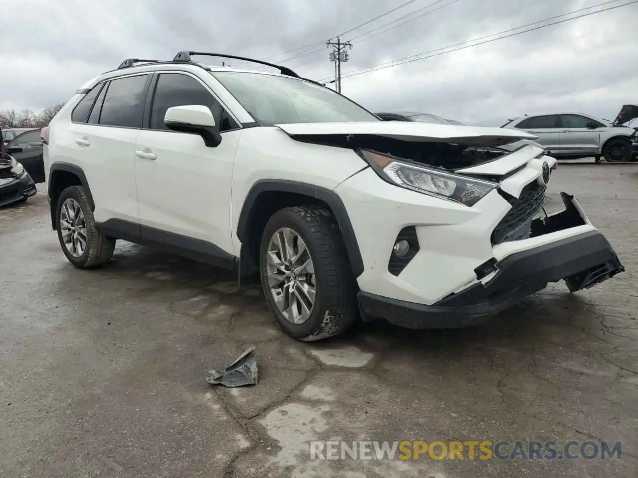 4 Photograph of a damaged car JTMA1RFV2KD509091 TOYOTA RAV4 2019