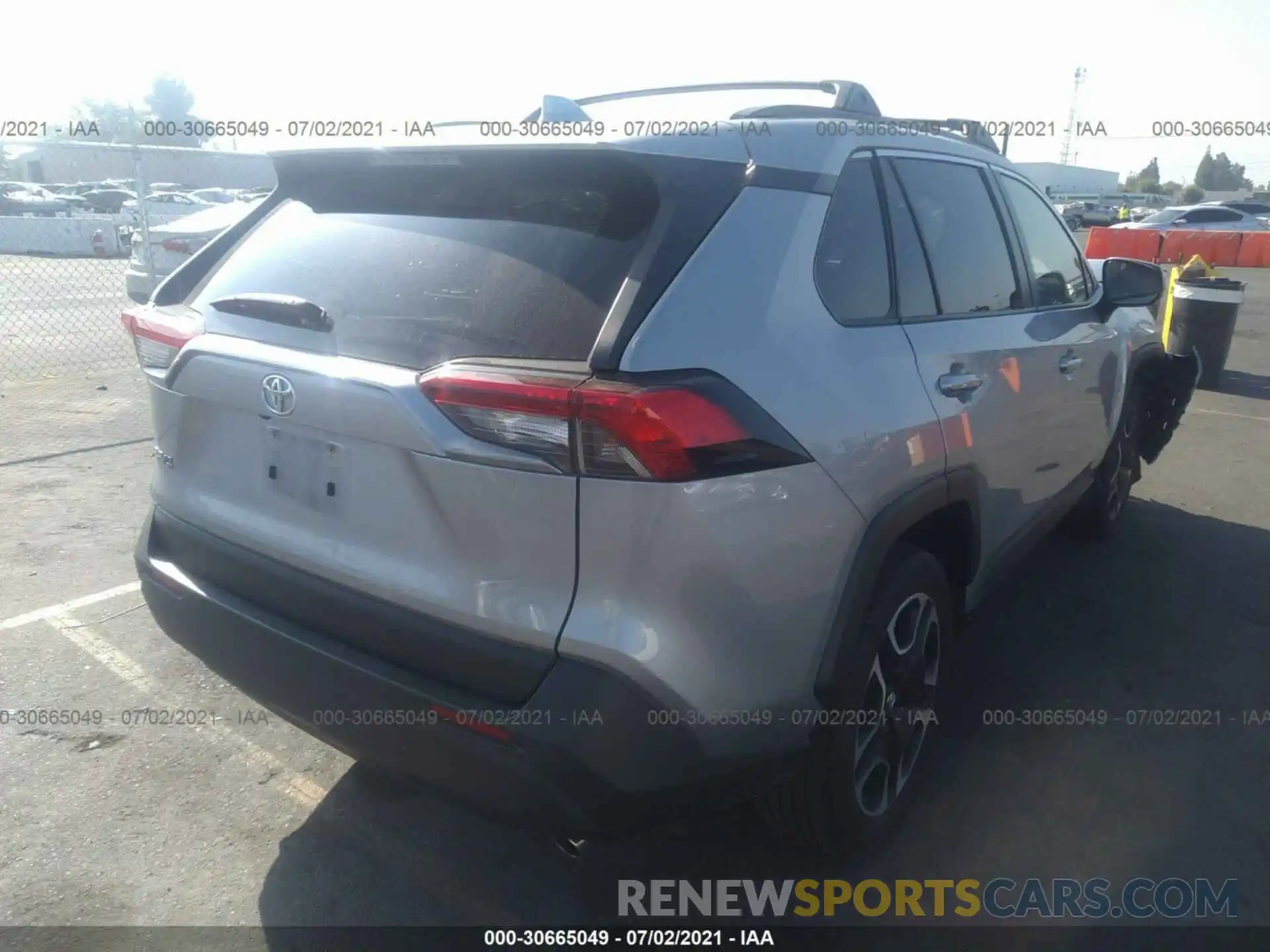 4 Photograph of a damaged car JTMH1RFV2KD512345 TOYOTA RAV4 2019