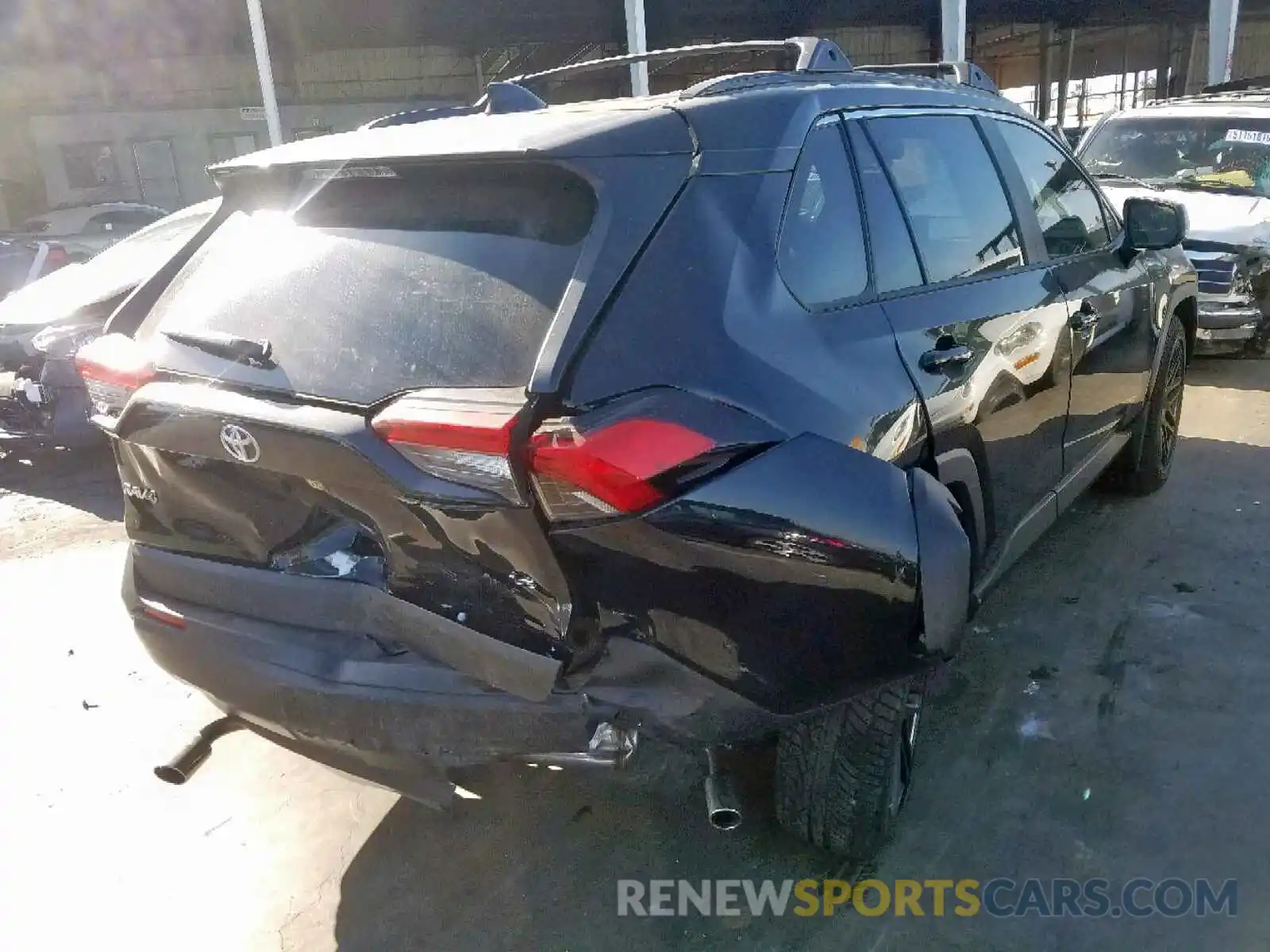 4 Photograph of a damaged car JTMH1RFV2KJ004409 TOYOTA RAV4 LE 2019